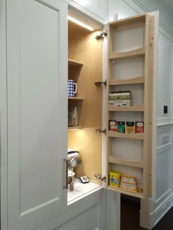 Custom storage cabinetry by Top Line Woodworking